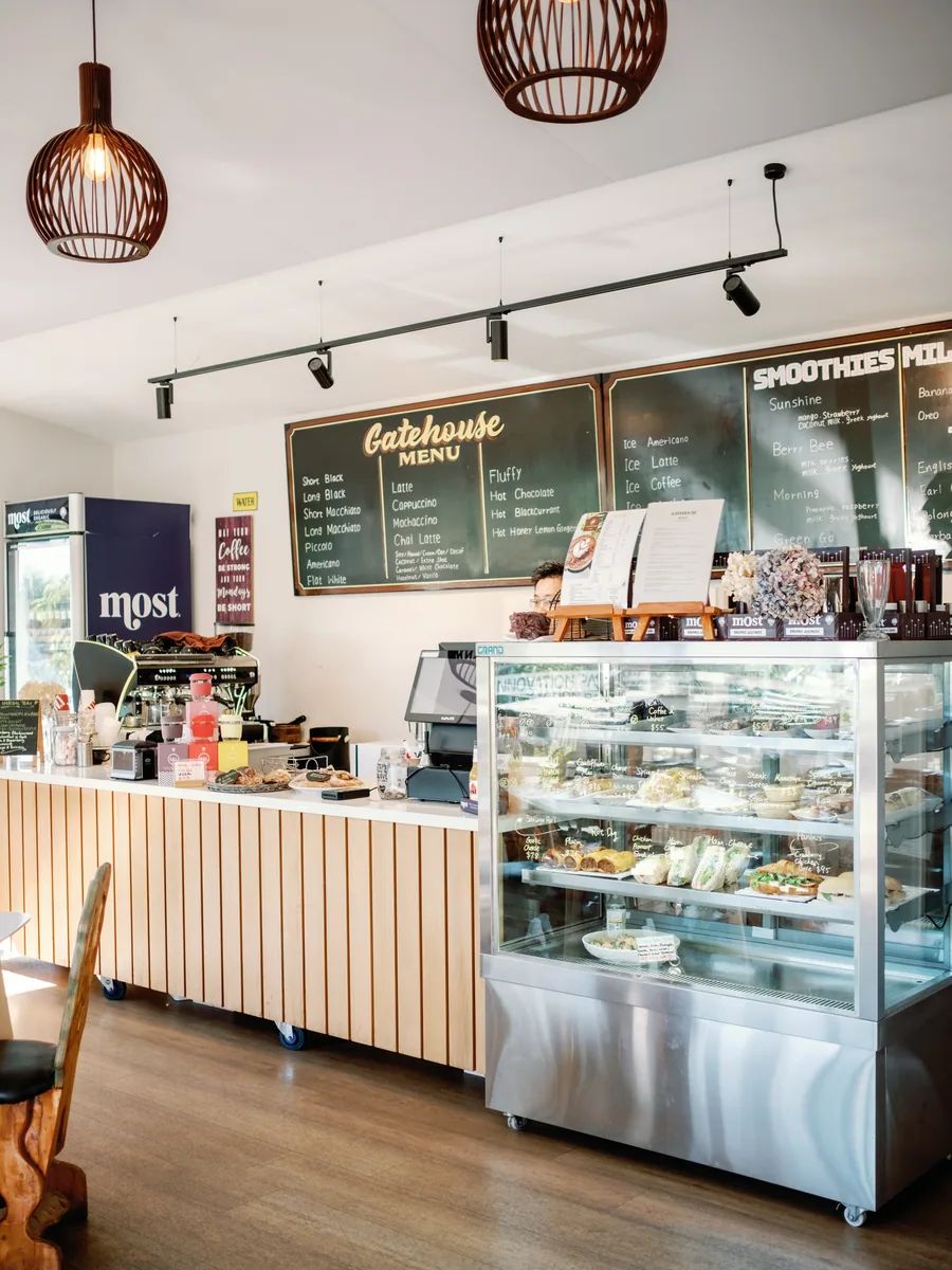 Gatehouse Cafe counter with cabinet food and menu boards
