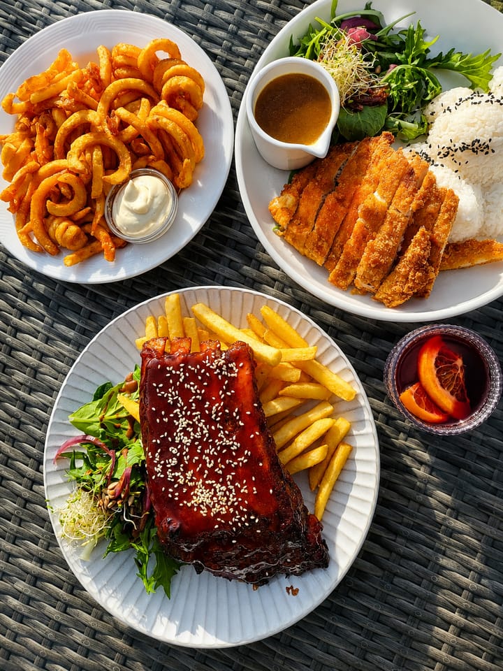 A selection of cafe plates served outdoors at Gatehouse Cafe