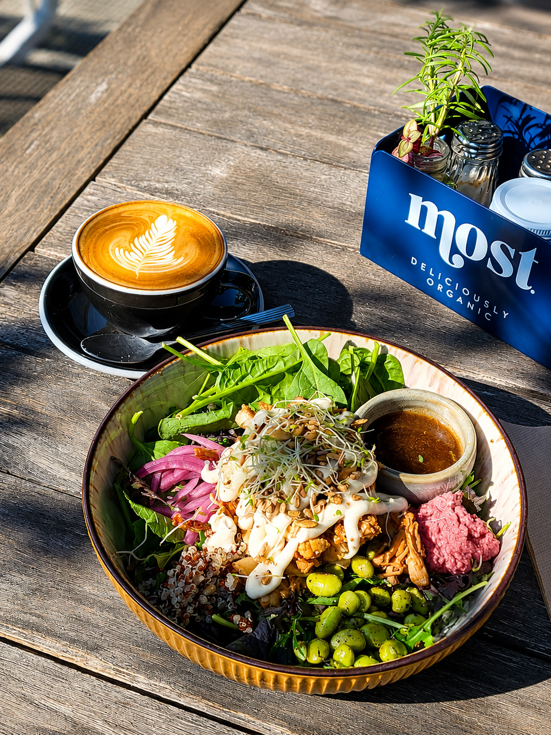 A salad bowl and coffee in the garden at Gatehouse Cafe