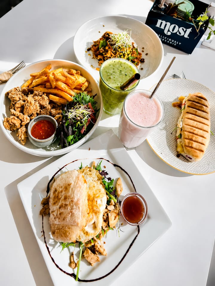 A selection of cafe lunch plates and drinks at Gatehouse Cafe