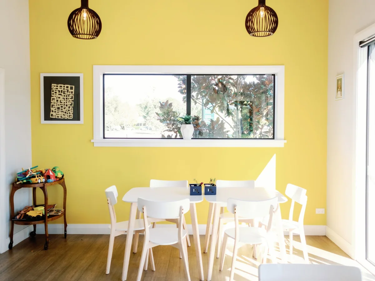 A sunny yellow seating corner inside Gatehouse Cafe
